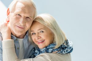 senior woman enjoying all-on-four implant dentures